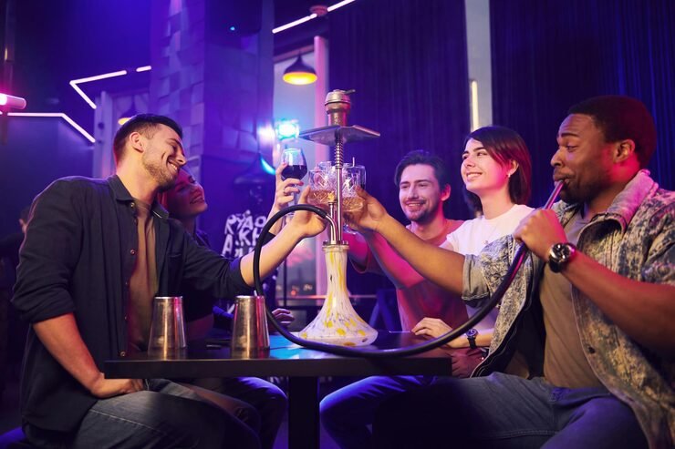 smoking-hookah-group-friends-having-fun-night-club-together_146671-69292