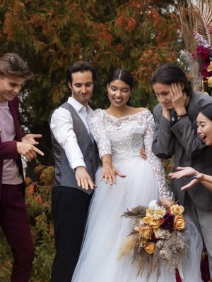 front-view-smiley-people-posing-wedding